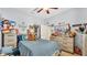 Nicely decorated bedroom with plenty of natural light, ceiling fan and fun decor at 2817 High Winds Ln, Lakeland, FL 33813