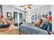 Charming bedroom with ceiling fan, window and decor at 2817 High Winds Ln, Lakeland, FL 33813