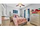 Cozy bedroom with window, dresser and soft lighting at 2817 High Winds Ln, Lakeland, FL 33813