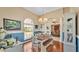 Bright dining room boasts a large window, rustic table and a chandelier at 2817 High Winds Ln, Lakeland, FL 33813