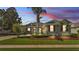 Charming home with well-manicured lawn, mature landscaping, and inviting entryway at 2817 High Winds Ln, Lakeland, FL 33813