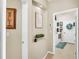 Hallway leading to laundry room with neutral color and decorations at 2817 High Winds Ln, Lakeland, FL 33813