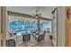 Relaxing screened-in lanai with comfortable seating, ceiling fans, and a view of the sparkling pool at 2817 High Winds Ln, Lakeland, FL 33813