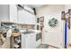 Functional laundry room with storage cabinets and modern appliances at 2817 High Winds Ln, Lakeland, FL 33813