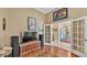 Spacious living room with high ceilings, hardwood floors, and adjacent dining area at 2817 High Winds Ln, Lakeland, FL 33813