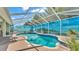 Sparkling pool with a screened enclosure, and a peaceful outdoor living space perfect for relaxation at 2817 High Winds Ln, Lakeland, FL 33813