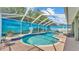 Beautiful screened-in pool and patio with view of mural and fountain features at 2817 High Winds Ln, Lakeland, FL 33813