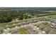 Aerial view showcases the home in a community setting, highlighting nearby green spaces and community layout at 2958 Flying Blackbird Rd, Bartow, FL 33830