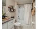 Bathroom with white vanity, granite countertops and a shower-tub combination at 2958 Flying Blackbird Rd, Bartow, FL 33830