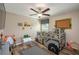 Charming bedroom with a bunk bed, ceiling fan and wood-look flooring at 2958 Flying Blackbird Rd, Bartow, FL 33830