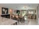 Open-concept living, dining, and kitchen area with lots of natural light at 2958 Flying Blackbird Rd, Bartow, FL 33830