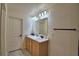 Bright bathroom featuring a double sink vanity at 312 Walnut Ln, Auburndale, FL 33823