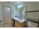Bathroom featuring hardwood floors, vanity with mirror, and toilet at 312 Walnut Ln, Auburndale, FL 33823