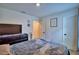 Well lit bedroom features decor, bed, and light from the window at 312 Walnut Ln, Auburndale, FL 33823