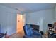 Bedroom features include a desk, futon, and comfortable recliner chair at 312 Walnut Ln, Auburndale, FL 33823