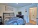 Inviting bedroom with a bed, dresser, and calming decor at 312 Walnut Ln, Auburndale, FL 33823