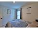 Well lit bedroom features decor, bed, and light from the window at 312 Walnut Ln, Auburndale, FL 33823