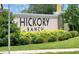 Hickory Ranch community sign with lush landscaping adding to the neighborhood's curb appeal at 312 Walnut Ln, Auburndale, FL 33823