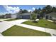 Charming single-story home with a well-maintained lawn and attached two car garage at 312 Walnut Ln, Auburndale, FL 33823