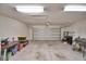 Spacious, unfinished garage with large garage door at 312 Walnut Ln, Auburndale, FL 33823