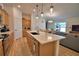 Open kitchen view showcasing a large island and connection to the living area at 312 Walnut Ln, Auburndale, FL 33823