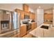 Well-equipped kitchen showcasing stainless steel appliances and quartz countertops at 312 Walnut Ln, Auburndale, FL 33823