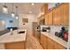 Spacious kitchen with stainless steel appliances and a view into the living area at 312 Walnut Ln, Auburndale, FL 33823