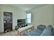 Living room features shelving, television, bench and comfortable couch at 312 Walnut Ln, Auburndale, FL 33823