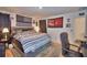 Comfortable main bedroom with bed, chair, and dark accent curtains at 312 Walnut Ln, Auburndale, FL 33823