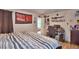 Comfortable bedroom with decorative wall hangings and desk at 312 Walnut Ln, Auburndale, FL 33823