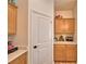 Convenient pantry with ample storage space and bright countertop at 312 Walnut Ln, Auburndale, FL 33823