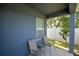 Outdoor patio with chairs, offering a relaxing outdoor space at 312 Walnut Ln, Auburndale, FL 33823