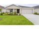Charming single-story home with a well-maintained lawn and inviting curb appeal at 3135 Laurel Oak Ln, Winter Haven, FL 33884