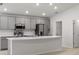 Kitchen featuring stainless steel appliances, a large island with a breakfast bar, and an open concept design at 3135 Laurel Oak Ln, Winter Haven, FL 33884