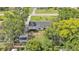 A lovely home sits nestled amongst mature trees and landscaping at 3235 Sandpiper Ln, Mulberry, FL 33860