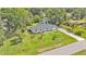 A stunning aerial view showcases this property's lush, mature landscaping at 3235 Sandpiper Ln, Mulberry, FL 33860