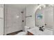 Stylish bathroom showcasing marble-look shower tile, modern vanity, and updated fixtures at 3235 Sandpiper Ln, Mulberry, FL 33860
