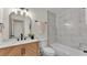 Bright bathroom featuring marble-look tile, a modern vanity, and updated fixtures at 3235 Sandpiper Ln, Mulberry, FL 33860