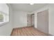 This bedroom features natural light, wood floors, and closet for storage at 3235 Sandpiper Ln, Mulberry, FL 33860