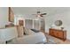 Relaxing bedroom featuring wood floors, closet space, and updated fixtures throughout at 3235 Sandpiper Ln, Mulberry, FL 33860