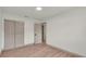 This bedroom boasts sleek wood floors, white walls, and features a closet for storage and organization at 3235 Sandpiper Ln, Mulberry, FL 33860