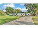 This beautiful home boasts immaculate landscaping and a lush green front yard at 3235 Sandpiper Ln, Mulberry, FL 33860
