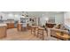 Open-concept kitchen and living area with modern finishes, island seating, and stylish furnishings at 3235 Sandpiper Ln, Mulberry, FL 33860