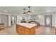 Bright and open kitchen with modern island and seating that flows into the living area at 3235 Sandpiper Ln, Mulberry, FL 33860