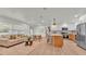 Spacious open-concept layout with a seamless flow between the living area and modern kitchen at 3235 Sandpiper Ln, Mulberry, FL 33860