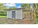 This shed is great for storage and features an attached dog run on a spacious lot at 3235 Sandpiper Ln, Mulberry, FL 33860