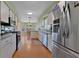 Spacious kitchen with modern appliances, white cabinets, and a view into the breakfast nook at 3783 Wildcat Run, Lakeland, FL 33810