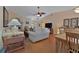 Spacious living room with wood flooring, ceiling fan, and a view into the dining area at 3783 Wildcat Run, Lakeland, FL 33810