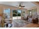 Bright sun room with large windows and sliding glass door offering scenic backyard views at 3783 Wildcat Run, Lakeland, FL 33810