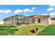 Beautiful backyard view with a screened in pool, patio, and green grass at 3787 Sandhill Crane Dr, Lakeland, FL 33811
